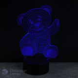 Blue teddy bear-shaped lamp on a black background. Infant gift idea for Australian kids.
