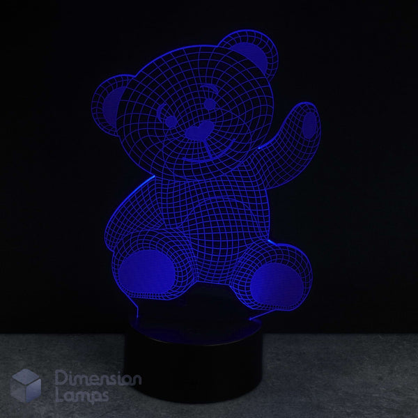 Blue teddy bear-shaped lamp on a black background. Infant gift idea for Australian kids.