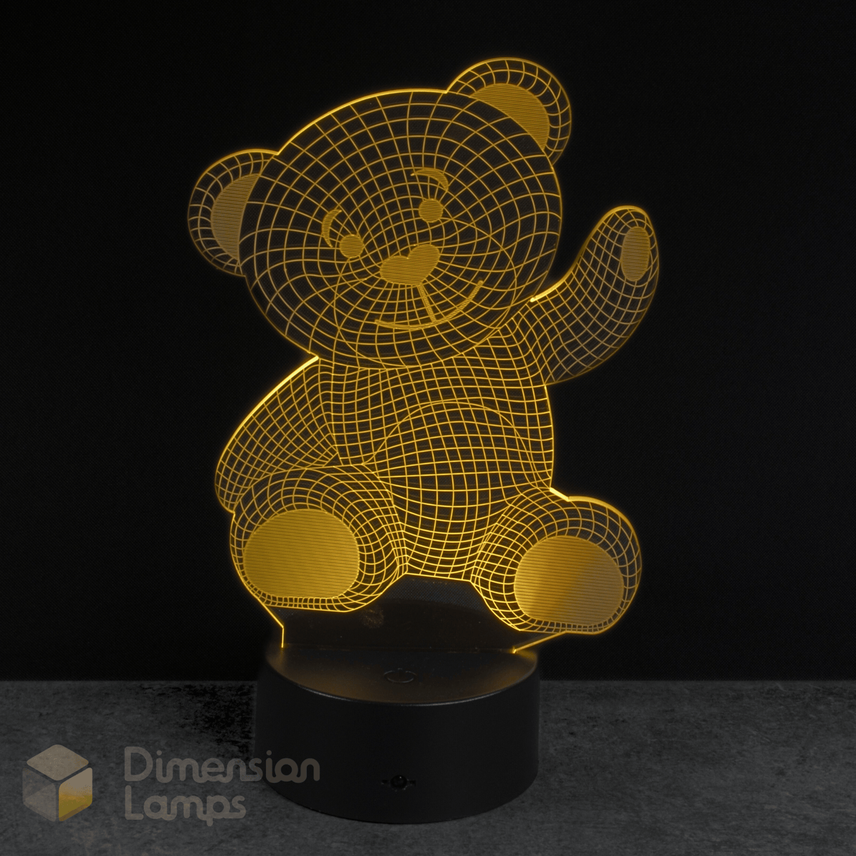 Yellow teddy bear-shaped lamp on a black background with 'Dimension Lamps' branding. Infant gift idea for Australian kids.