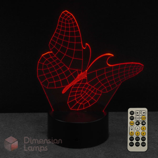 Red wireframe butterfly-shaped 3D LED lamp with remote control on a dark background