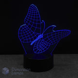 Butterfly-shaped night light with blue LED illumination on a dark background. Kids night light idea.
