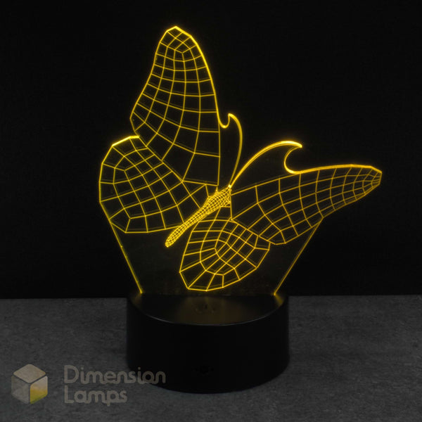 Wireframe butterfly-shaped night light with yellow outline on a black background. Infants nursery night light.
