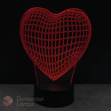 Wireframe heart-shaped lamp with grid pattern on a dark background, featuring the brand 'Dimension Lamps'.