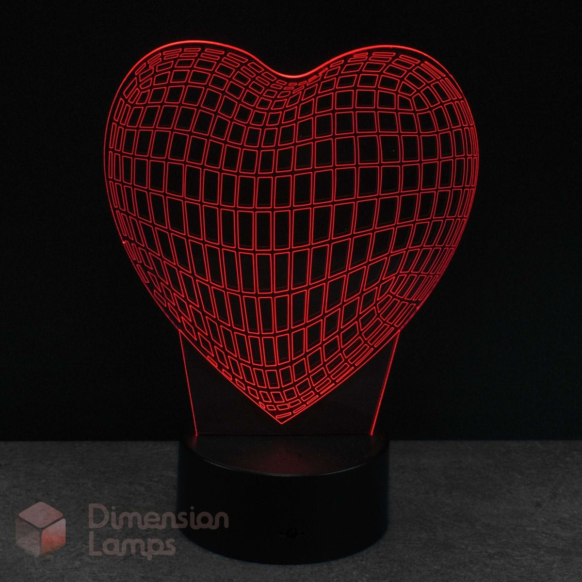 Wireframe heart-shaped lamp with grid pattern on a dark background, featuring the brand 'Dimension Lamps'.