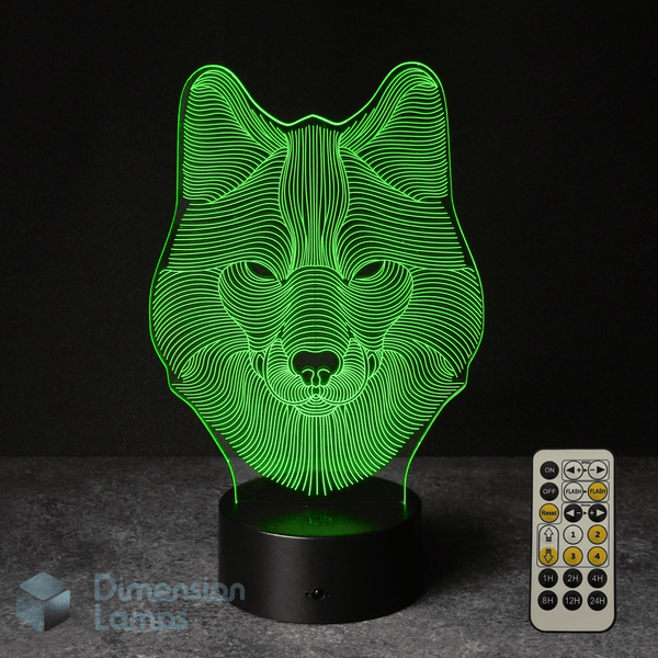 3D wolf lamp with green light and remote control on a dark background