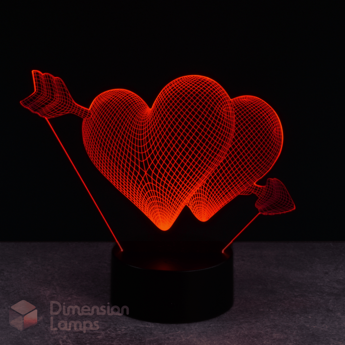 This red hearts and arrow LED 3D lamp creates a glowing affection-themed image. A distinctive nightlight, perfect for a girl's bedroom decor. 
