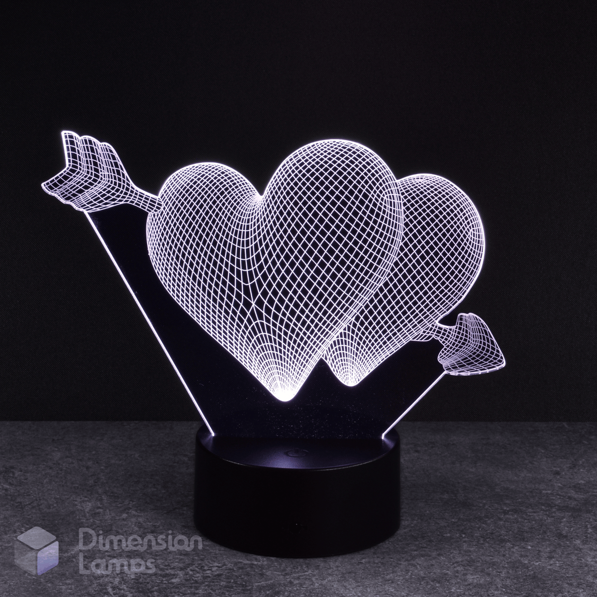 White hearts and arrow 3d night lamps: a love-themed design featuring two hearts pierced by an arrow, illuminated by white LEDs on a base against a dark background. A unique lighting solution for a girl's room. 
