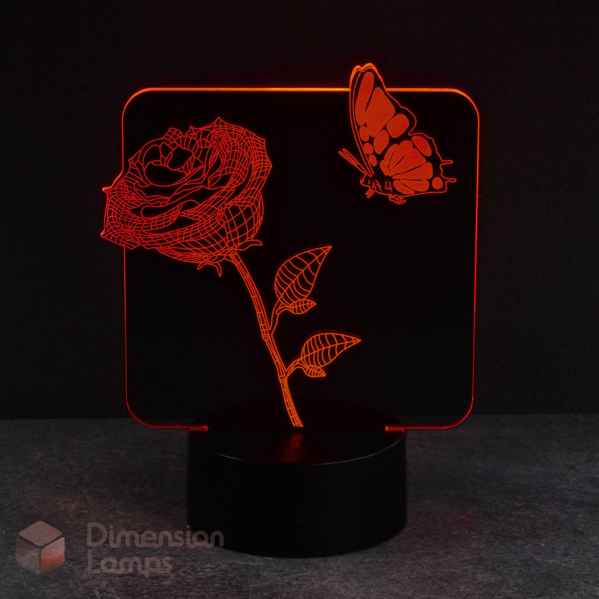 Red rose butterfly 3d night lamps: a floral and insect design illuminated by red LEDs on a base against a dark background. A unique and calming kids night light.