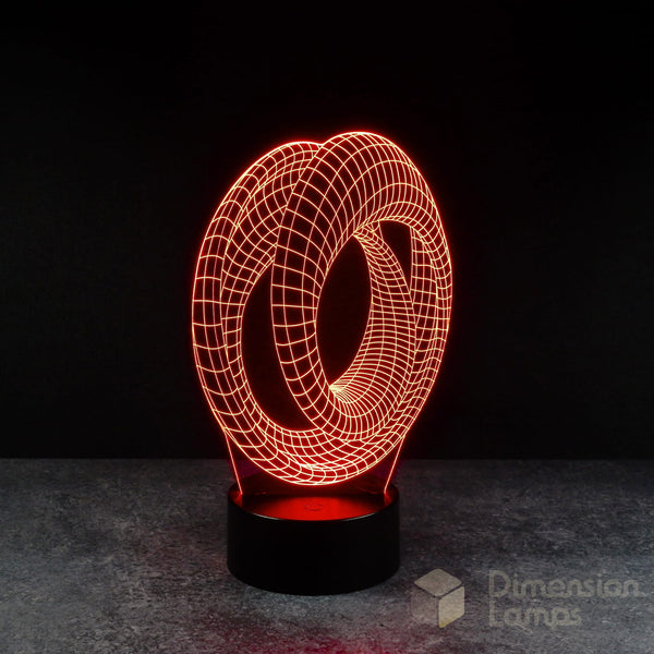 Red Mobius strip 3d night lamps: a continuous looped geometric design illuminated on a lamp, rising from a base against a dark background. A subtle nod to the complexities of Marvel Avengers Endgame for fans in Australia. 
