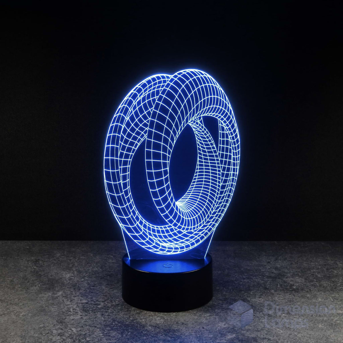 A 3D illusion lamp presents a Mobius strip pattern, illuminated in blue, forming a continuous one-sided surface on a base against a dark background. Its infinite nature may resonate with the themes of Marvel Avengers Endgame for viewers in Australia.
