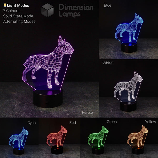 A 3D dog lamp in the shape of a Bull Terrier, noted for its strong physique and elongated, curved head, is presented in a seven-colour collage: purple, blue, white, cyan, red, green, and yellow, each on a black base. A contemporary gift for Bull Terrier owners and dog admirers in Australia. 