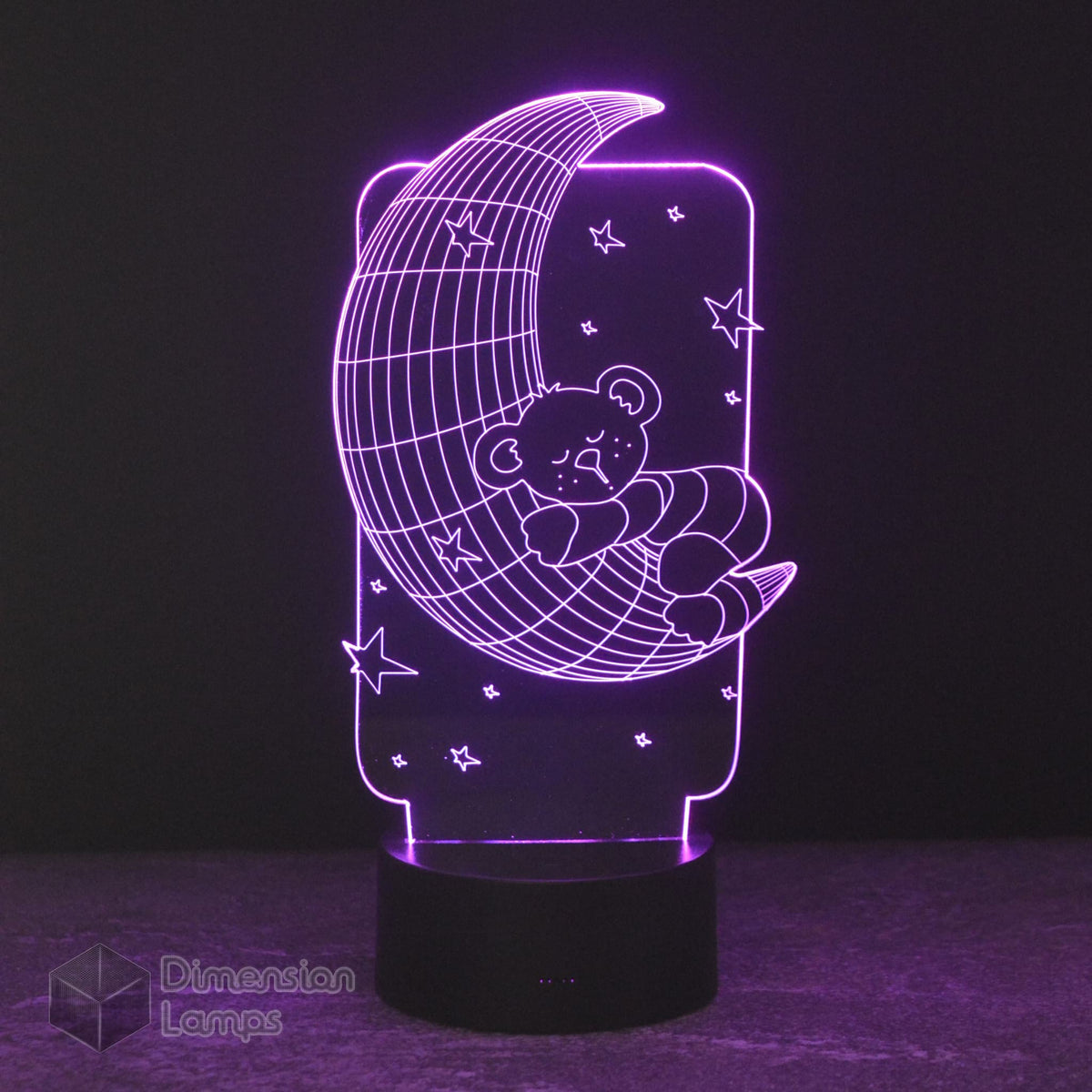 Nightlight featuring a 3D design of a teddy bear sleeping on a crescent moon surrounded by stars. This lamp emitting a calming purple light for a child's bedroom by Dimension Lamps..