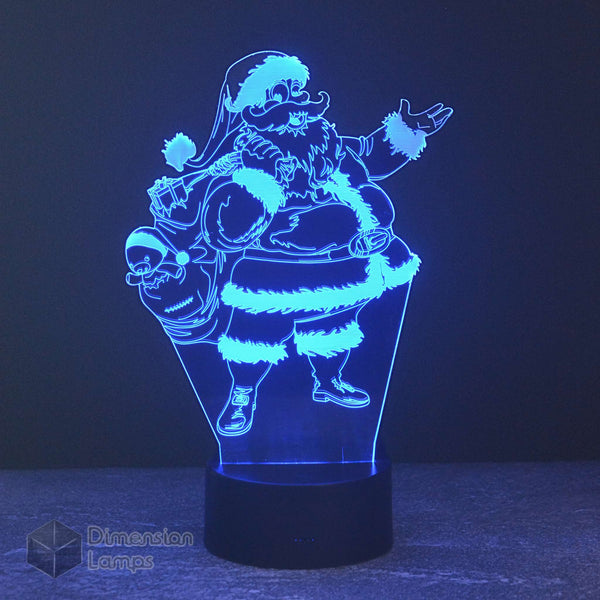 A 3D illusion lamp of Santa Claus carrying a sack overflowing with various Christmas presents, emitting a soft blue light ideal for festive holiday decorations.