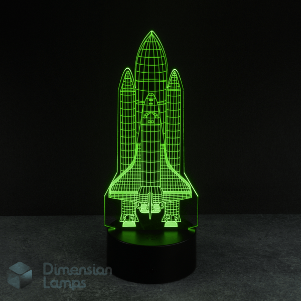 This green Space Shuttle LED 3D lamp features an intricate design of a rocket ready for launch. A distinctive nightlight for boys, adding a cosmic touch to their bedroom decor.