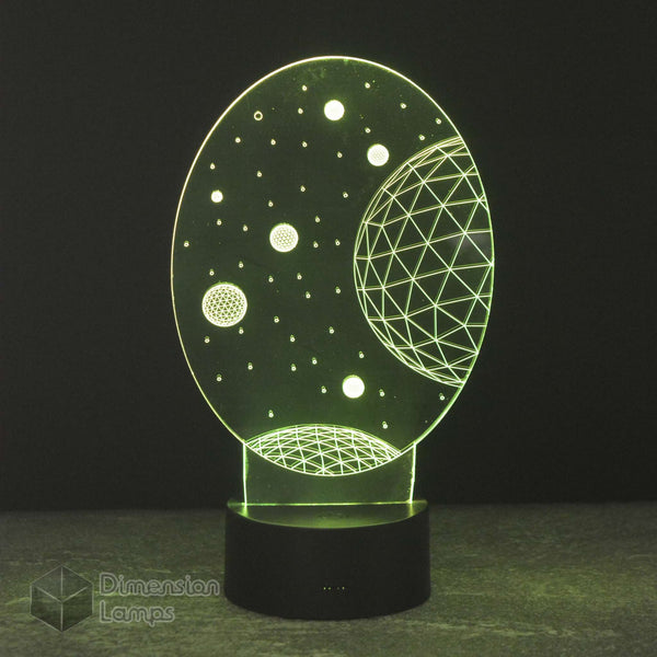 Green Planets 3D lamp: space-themed night light for kids. Features various planets and stars, emitting a gentle green glow for a child's room. 
