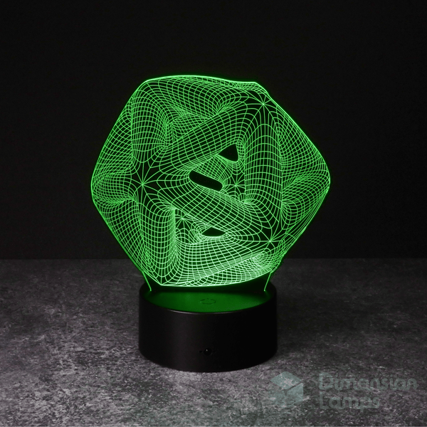A green illuminated 3D lamp in the shape of an icosahedron, a geometric form composed of twenty triangular surfaces, displayed on a black base against a dark background. This functions as both a unique study aid and a contemporary office lamp option in Australia.
