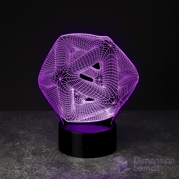 A purple illuminated 3D lamp in the shape of an icosahedron, a geometric form composed of twenty triangular surfaces, displayed on a black base against a dark background. This functions as both a unique study aid and a contemporary office lamp option in Australia.