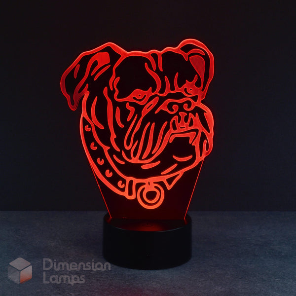 A red illuminated 3D lamp showcases a detailed laser-etched design of a bulldog's head with a collar, standing on a black base against a dark background. A unique gift idea for bulldog owners across Australia.