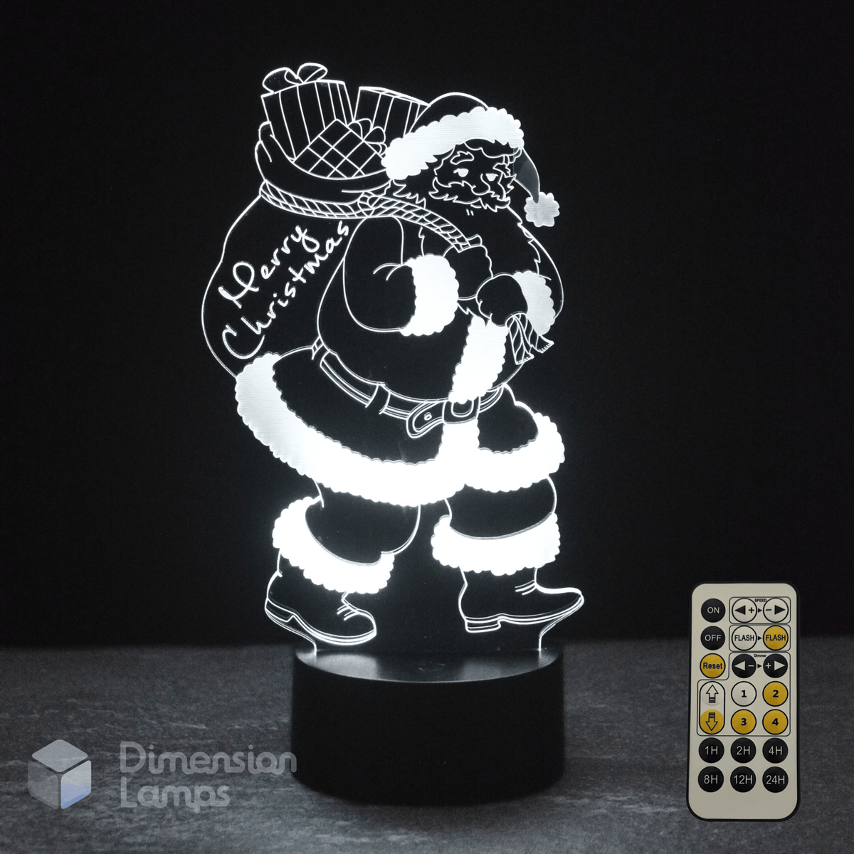 3D LED lamp with Santa Claus design and remote control on a dark background