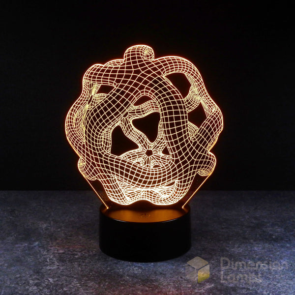 Nightlight: A 3D lamp with a complex, warped geometric pattern, glowing yellow and rising from a black base against a dark background. A cool night light for teens. 