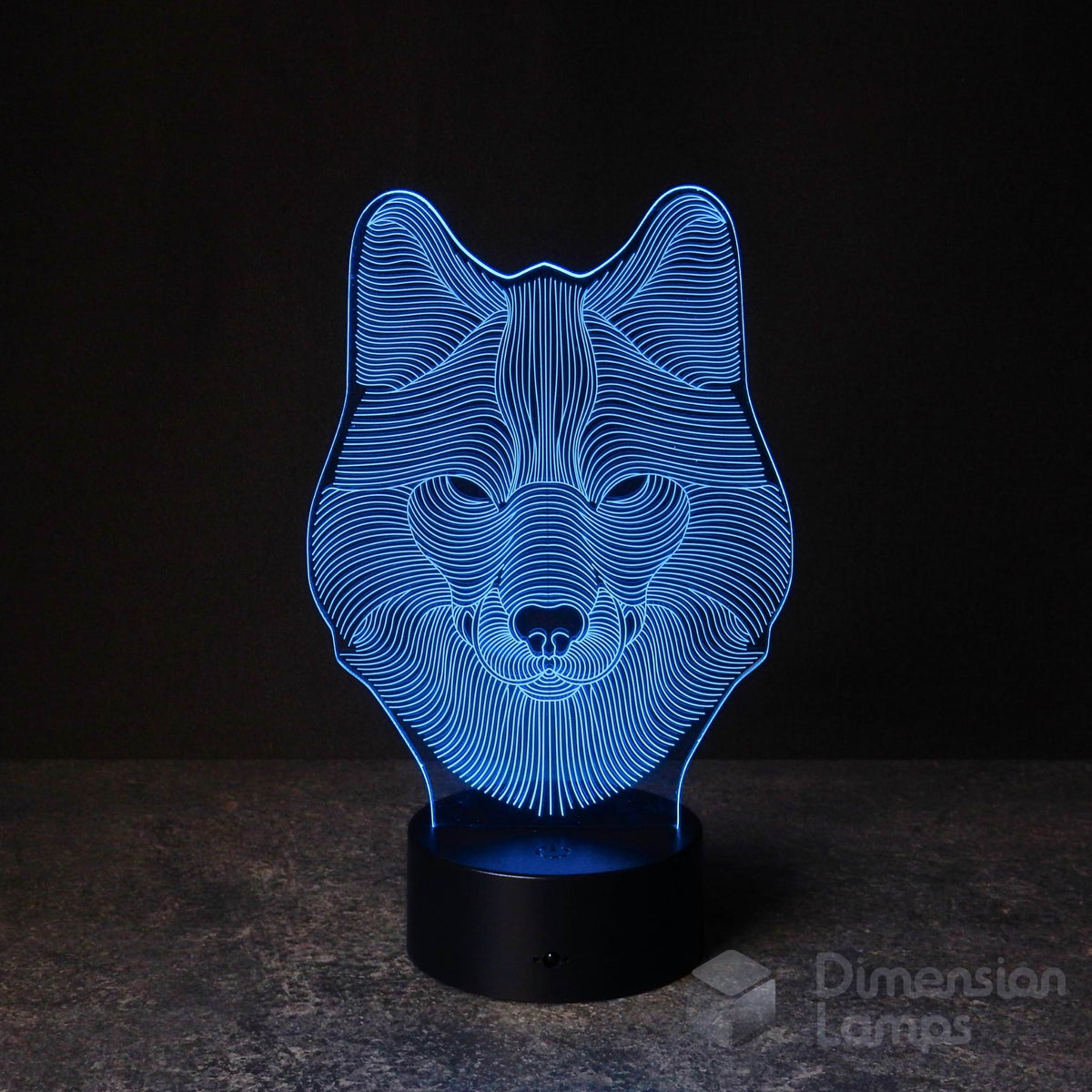 A 3D illusion lamp of a wolf's head, emitting a striking blue light. A unique decorative piece for any living space in Australia, gift idea for teens.