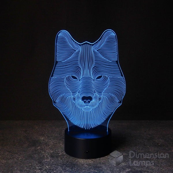 A 3D illusion lamp of a wolf's head, emitting a striking blue light. A unique decorative piece for any living space in Australia, gift idea for teens.