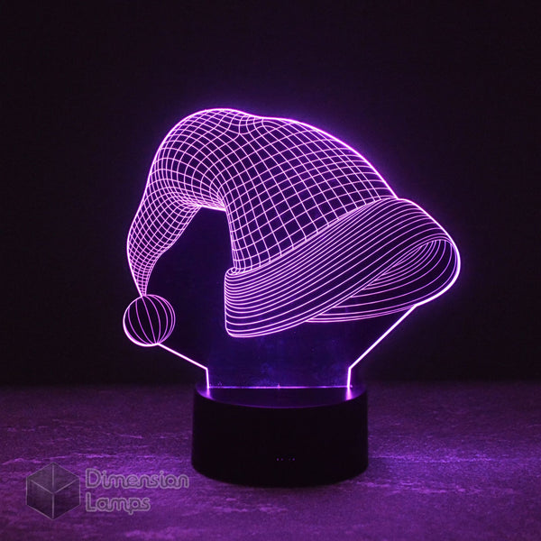 Nightlight featuring a 3D Santa Hat design, illuminated in purple. This lamp provides unique Christmas lighting for a distinctive festive atmosphere. 