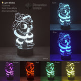 A detailed view of a 3D Santa illusion lamp, ideal for unique Christmas decoration. The collage presents its seven available colours and the charming 