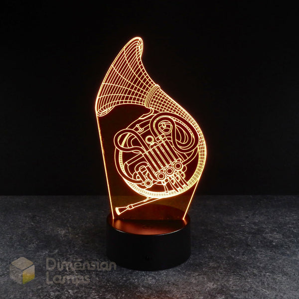 Yellow french horn 3d night lamps: yellow illumination of a detailed French horn outline on a lamp, rising from a base against a dark background. A thoughtful gift idea for brass players, hornists, and musicians.