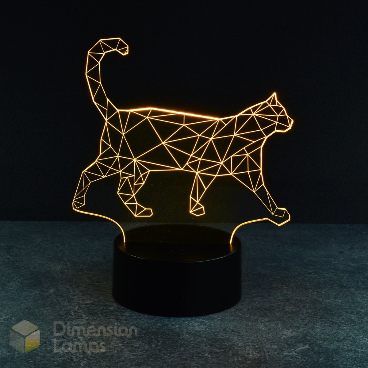 A 3D lamp with a black base emits a yellow glow, highlighting the geometric wireframe design of a cat in a walking pose, making it a cool nightlight for cat fans and pet admirers.
